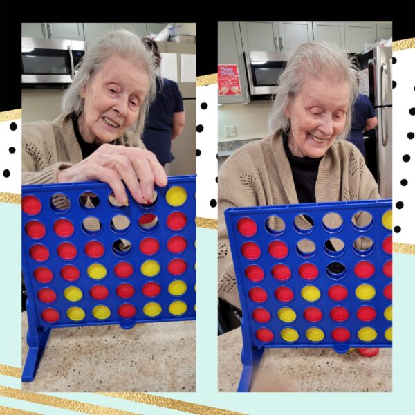elderly women playing connect four board game for an activity